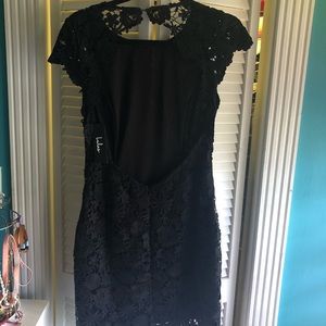 Black lace, open back mid knee dress